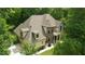 Aerial view of the home showcasing the roof, landscaping, and three-car garage at 1217 Mauldin Rd, Wake Forest, NC 27587