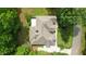 An overhead shot displays the home's roofline and surrounding landscape, highlighting its spacious grounds at 1217 Mauldin Rd, Wake Forest, NC 27587