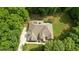 Expansive home nestled among mature trees, offering privacy and a picturesque setting at 1217 Mauldin Rd, Wake Forest, NC 27587
