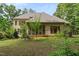 Lush backyard with mature trees, offering privacy and a serene outdoor setting at 1217 Mauldin Rd, Wake Forest, NC 27587