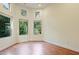 Empty hardwood floor room with large windows at 1217 Mauldin Rd, Wake Forest, NC 27587