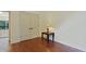 Hardwood floor room with lamp on table and double doors to the hall at 1217 Mauldin Rd, Wake Forest, NC 27587