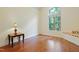 Bright bedroom boasts hardwood floors and a large window seat at 1217 Mauldin Rd, Wake Forest, NC 27587