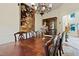 Dining room featuring a grand table, decorative chandelier, and elegant display cabinet at 1217 Mauldin Rd, Wake Forest, NC 27587