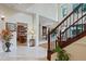 Spacious entryway featuring grand staircase and views of the kitchen and dining areas at 1217 Mauldin Rd, Wake Forest, NC 27587