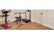 Private gym space equipped with various exercise machines and wood-look flooring at 1217 Mauldin Rd, Wake Forest, NC 27587