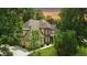 Front elevation featuring a stone facade, attached garage, and lush greenery at 1217 Mauldin Rd, Wake Forest, NC 27587