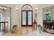 Bright foyer with marble floors, chandelier, decorative double doors, and elegant decor at 1217 Mauldin Rd, Wake Forest, NC 27587