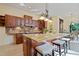 Gourmet kitchen with granite countertops, stainless steel appliances and island with barstool seating at 1217 Mauldin Rd, Wake Forest, NC 27587