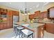 Kitchen with granite counters, stainless steel appliances and central island with seating at 1217 Mauldin Rd, Wake Forest, NC 27587