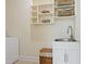 Functional laundry room offers sink, cabinet, and storage options at 1217 Mauldin Rd, Wake Forest, NC 27587