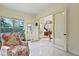 Inviting living room with decorative chair, tile floors, and access to foyer at 1217 Mauldin Rd, Wake Forest, NC 27587