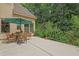 Enjoy the peaceful surroundings in this patio setting, complete with a dining set and access to the lush backyard at 1217 Mauldin Rd, Wake Forest, NC 27587