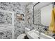 Stylish powder room with patterned wallpaper and modern fixtures at 122 N Harrington St # 775, Raleigh, NC 27603