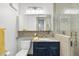 Modern bathroom featuring a sleek vanity, stylish mirror, and a glass-enclosed shower with elegant tiling at 122 N Harrington St # 775, Raleigh, NC 27603