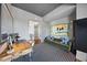 Bright office space with dark ceiling and large painting at 122 N Harrington St # 775, Raleigh, NC 27603
