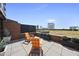 Rooftop patio featuring comfortable Adirondack chairs, planters, and cityscape views, ideal for relaxation at 122 N Harrington St # 775, Raleigh, NC 27603