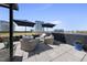 Attractive rooftop terrace featuring sun umbrellas, comfortable seating, and elegant planters, perfect for outdoor enjoyment at 122 N Harrington St # 775, Raleigh, NC 27603