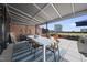 Covered rooftop patio with dining and lounge areas, perfect for entertaining at 122 N Harrington St # 775, Raleigh, NC 27603