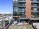 Rooftop terrace with blue umbrellas, outdoor furniture, and city views at 122 N Harrington St # 775, Raleigh, NC 27603