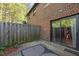 Relaxing back patio with brick and sliding glass doors that lead into the house at 1220 Manassas Ct Ct # E, Raleigh, NC 27609