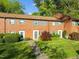 Traditional brick townhome with well-maintained landscaping and a welcoming entrance at 1220 Manassas Ct Ct # E, Raleigh, NC 27609