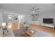 Comfortable living room features neutral colors, built-in shelving and a ceiling fan at 1220 Manassas Ct Ct # E, Raleigh, NC 27609
