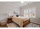 Comfortable bedroom featuring natural light, stylish rug, bedside table, and coordinated decor at 1243 White Flint Cir, Durham, NC 27703