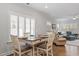 Dining area with wood floors, bright windows with wood shutters, and an open concept at 1243 White Flint Cir, Durham, NC 27703