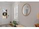Bright entryway featuring a decorative mirror, white door, and stylish accents at 1243 White Flint Cir, Durham, NC 27703