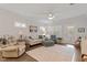 Bright living room with hardwood floors, ceiling fan, and neutral decor at 1243 White Flint Cir, Durham, NC 27703