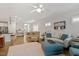 Open-concept living area with hardwood floors, ceiling fan, open-concept flow, and modern decor at 1243 White Flint Cir, Durham, NC 27703