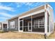 Spacious screened-in porch with neutral tones, offering a relaxing outdoor living space at 1243 White Flint Cir, Durham, NC 27703