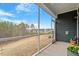 Enjoy a scenic view from this screened porch overlooking the backyard and beyond at 1243 White Flint Cir, Durham, NC 27703