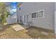 Backyard patio and exterior featuring neutral vinyl siding and lawn at 125 Hidden Springs Dr, Durham, NC 27703