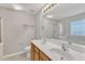 A pristine bathroom featuring a double sink vanity, and a large mirror at 125 Hidden Springs Dr, Durham, NC 27703