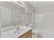 Bathroom features vanity with tub and shower combo and neutral walls at 125 Hidden Springs Dr, Durham, NC 27703