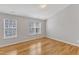 Empty bedroom with hardwood floors, neutral walls, and natural light at 125 Hidden Springs Dr, Durham, NC 27703