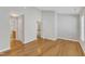 An airy bedroom featuring gleaming hardwood floors, neutral paint, and ample natural light at 125 Hidden Springs Dr, Durham, NC 27703