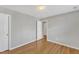Empty bedroom with hardwood floors and neutral walls at 125 Hidden Springs Dr, Durham, NC 27703