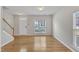 Bright living room with hardwood floors and a staircase at 125 Hidden Springs Dr, Durham, NC 27703
