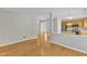 Open floor plan showcasing hardwood floors connecting living space to the kitchen at 125 Hidden Springs Dr, Durham, NC 27703