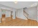 Spacious living room featuring hardwood floors, stairs, and neutral paint at 125 Hidden Springs Dr, Durham, NC 27703