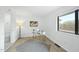Bright bedroom features a desk, sleek flooring, and a sliding door closet at 1277 Teakwood Pl, Raleigh, NC 27606