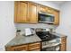 Well-equipped kitchen featuring stainless appliances and ample countertop space for cooking at 1277 Teakwood Pl, Raleigh, NC 27606