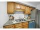 Kitchen boasts granite countertops, stainless steel appliances, and warm wood cabinets at 1277 Teakwood Pl, Raleigh, NC 27606