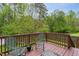 A peaceful deck with seating offers a relaxing outdoor space overlooking the lush backyard at 136 Ashlyn Ridge Dr, Garner, NC 27529
