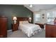The main bedroom features a vaulted ceiling, warm wall colors and carpet at 136 Ashlyn Ridge Dr, Garner, NC 27529