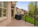 View of a charming back deck with a grill, overlooking a green lawn and wooded area at 144 Arabella Ct, Cary, NC 27518