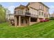 Large brick home has a manicured lawn with walkout basement at 144 Arabella Ct, Cary, NC 27518